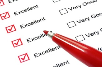 Red felt-tip pen over "excellent" ratings on checklist.